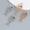Spring Fish-Shaped Earrings: Simple European & American Hollow Alloy Design.