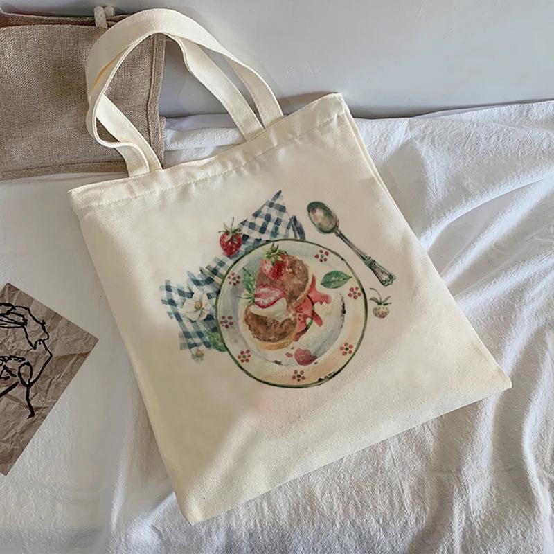 2022 Лето Новая женская дизайнерская сумка с мультяшным принтом Женская белая простая сумка через плечо Большой емкости Повседневная сумка Холст H