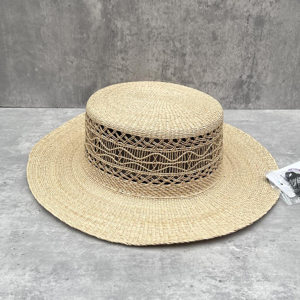 Lafite retro straw hat women's summer new hollow flat top top hat seaside sun protection elegant vacation style shows temperament