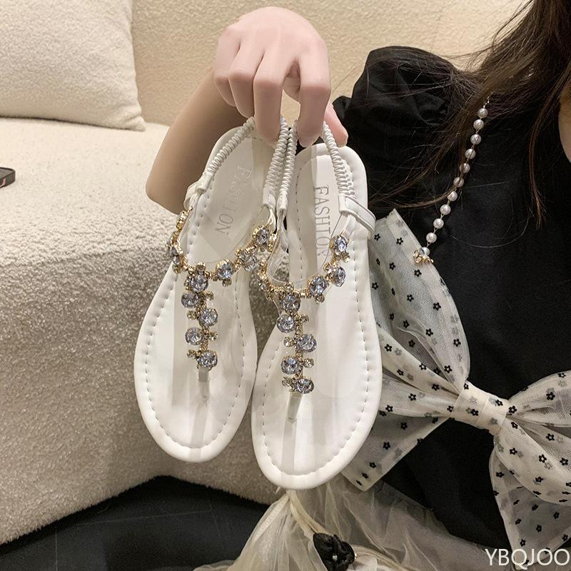 Модные женские сандалии на плоской подошве 2025 Лето Новые туфли с водными бриллиантами Большого размера пляжные шлепанцы с перемычкой между пальцами Модные ажурные женские элегантные сандалии