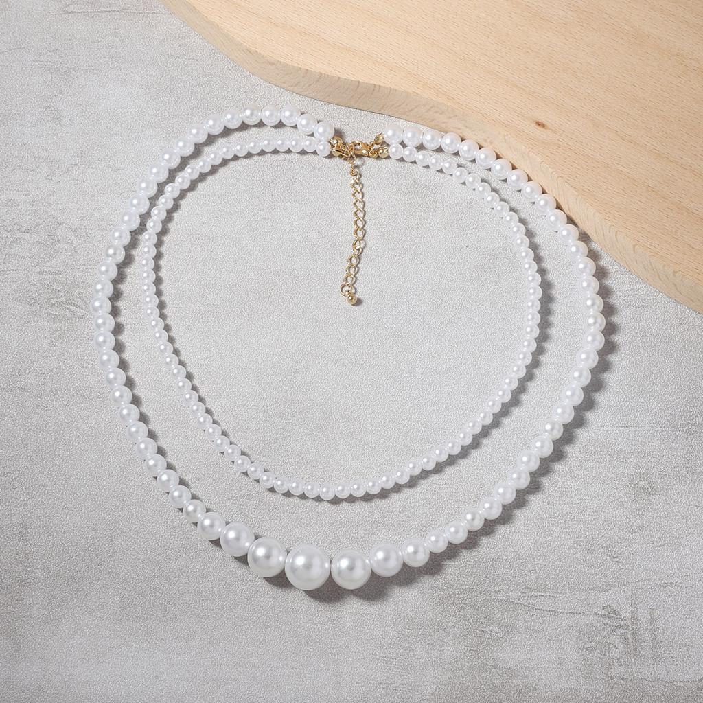 Korean version of temperament sweet casual fashion imitation pearl niche multi-layer design necklace, versatile French retro