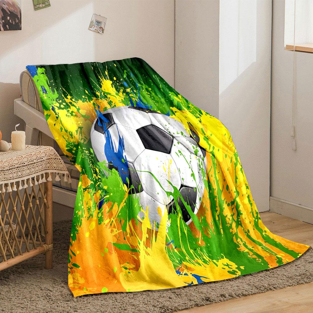A soccer ball surrounded by dynamic splashes of yellow, green, and blue. for all seasons blanket lunch break throw gift