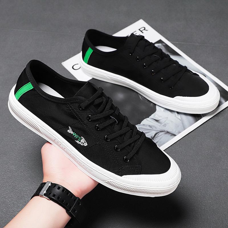 Four Seasons Men's White Canvas Shoes: Korean Style, Casual, Breathable, Lace-up, Low-top Fashion Sneakers.