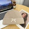 Red bow knitted hat women's versatile face small wool hat outdoor cold-proof and warm bag head cold hat