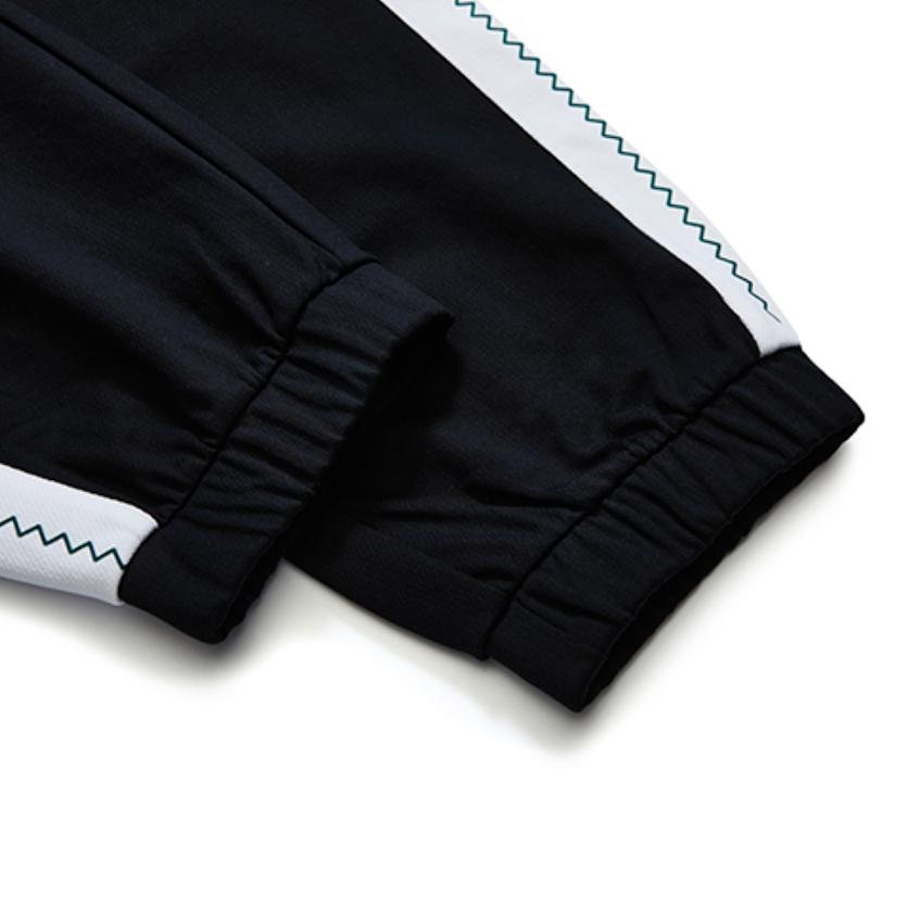 Fila Fusion Полосатые повседневные длинные брюки с блоками цвета и свободной манжетой Женские брюки Глубокий черный T11W233604FBK