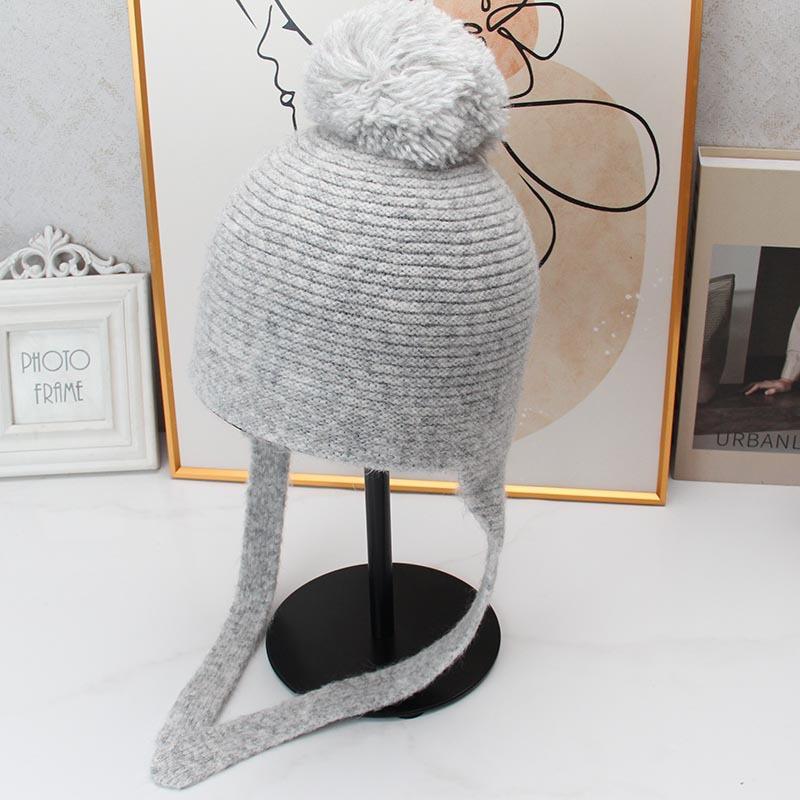Cute hairball lace-up ear hat retro knitted wool hat autumn and winter outdoor cold-proof face little Lei Feng hat