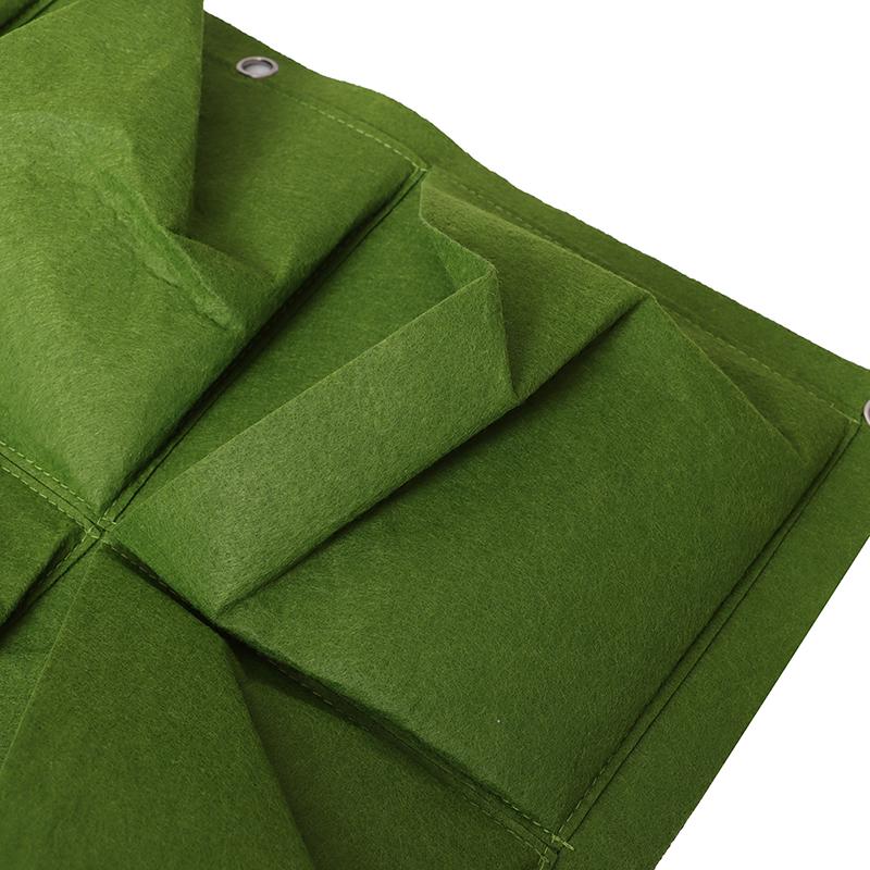 Зеленые вертикальные висячие цветочные горшки садового плантатора кладут в сумку подвес держателя стены