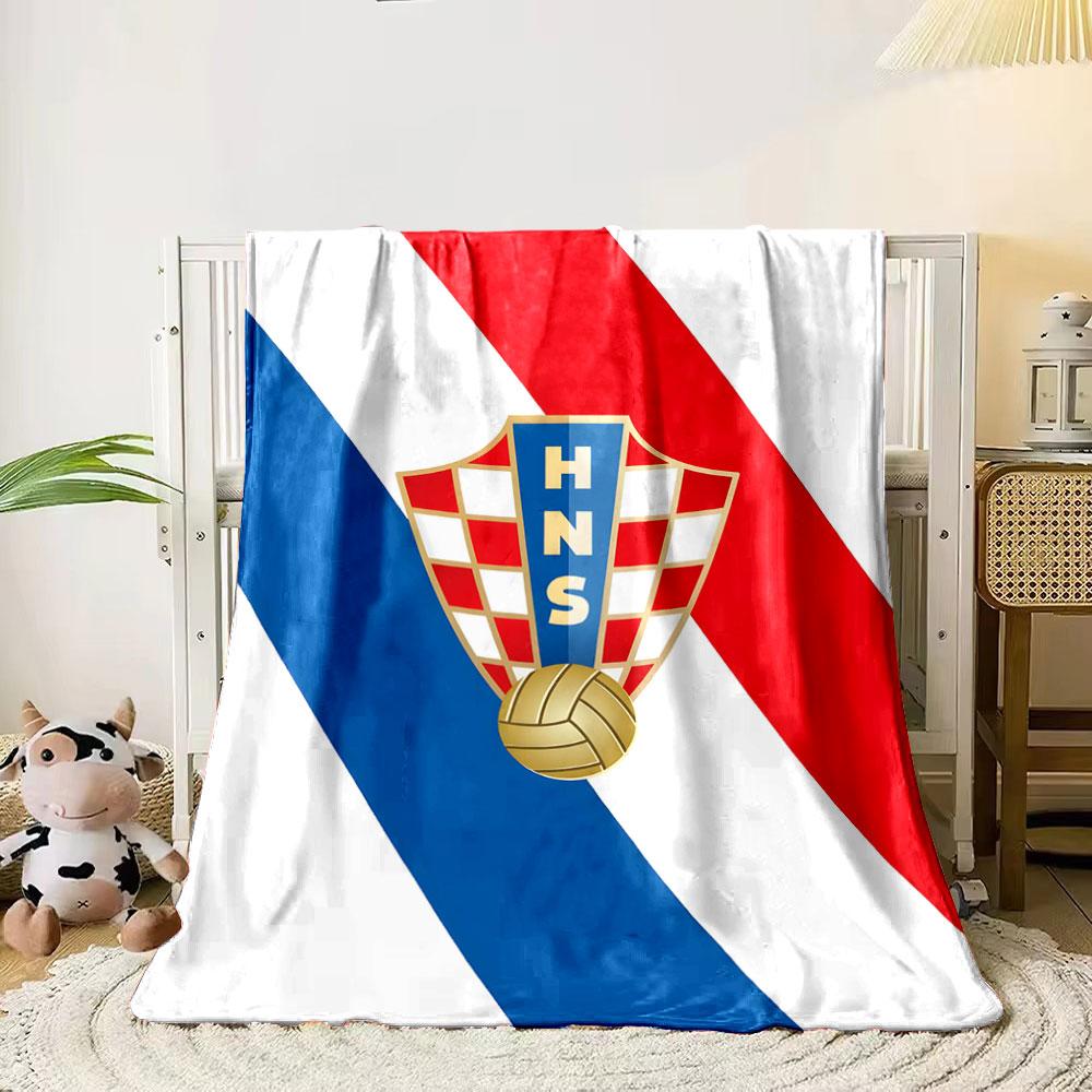 A shield with red-white checkerboard, "HNS," and a golden soccer ball motif. for all seasons blanket lunch break throw gift