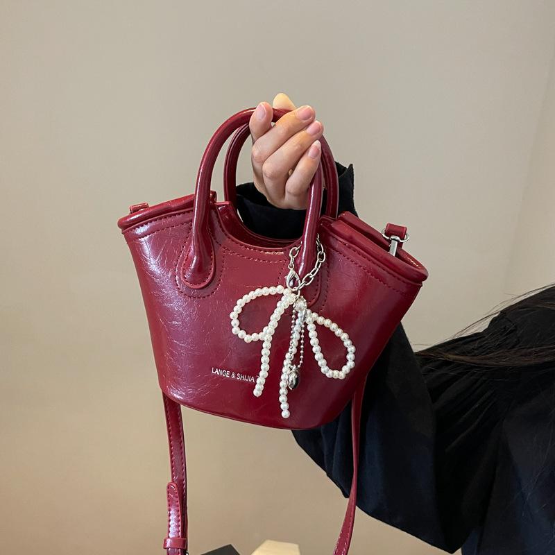 Сумка женская 2025 новая сумка-мессенджер модный нишевый дизайн летняя портативная сумка-ведро рабочая маленькая сумка