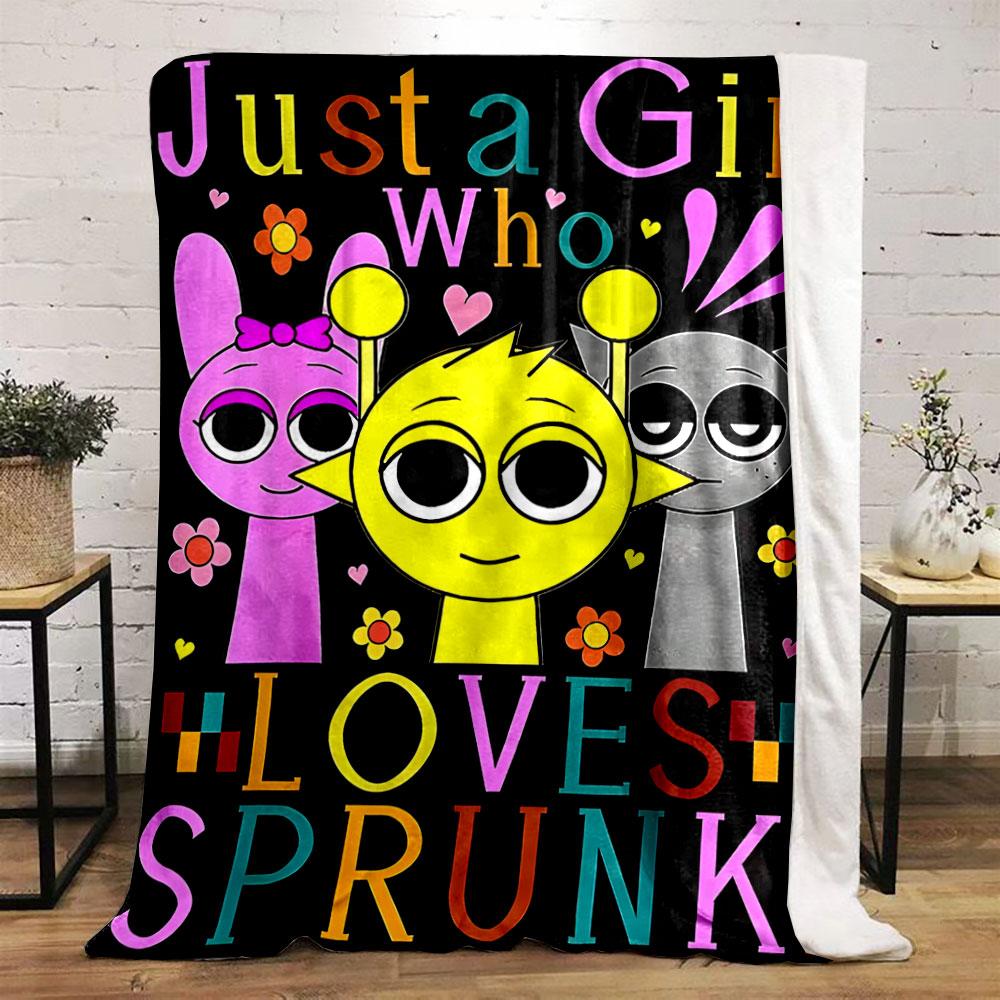 Three cartoon characters with colorful text and flowers on a black background. for all seasons blanket lunch break throw gift